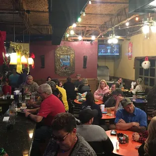 a large group of people sitting at tables