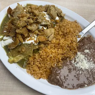 Green chilaquiles plate with chicken and egg