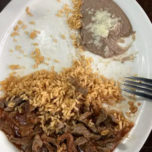 steak, rice, refried beans