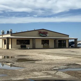 front of restaurant (beware that portions of the surface of the parking lot are not suitable for cars)