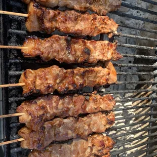 skewered meat on a grill
