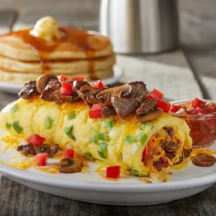 a plate of breakfast food with pancakes