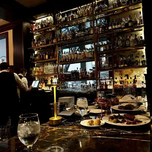 a man standing at a bar