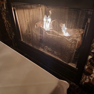 Seated next to the fireplace. Nice touch