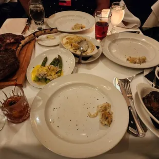 a table of food and wine glasses