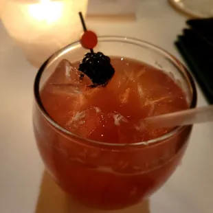 a drink in a glass on a table