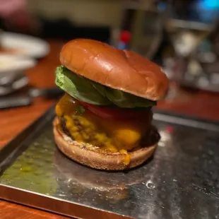 a cheeseburger on a tray