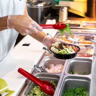 a person preparing a salad