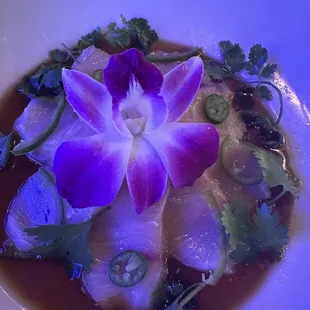 Yuzu Hamachi sashimi basking in blue ambiance. It was delicious.