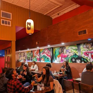 a group of people eating at a restaurant