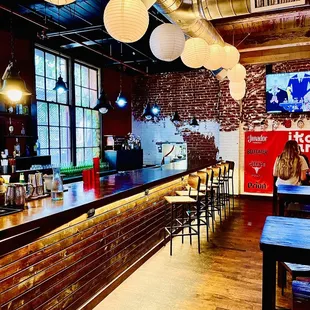 a bar with tables and chairs