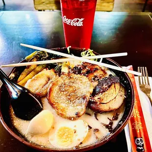 a bowl of ramen and a drink