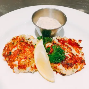 two crab cakes on a white plate