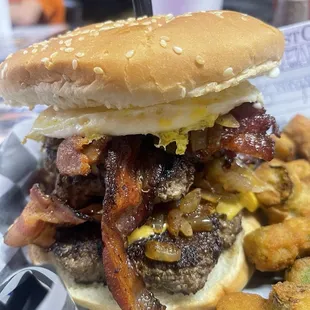 Double cheeseburger with grilled onions, bacon, egg, &amp; cheese!