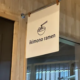 a sign hanging from the ceiling