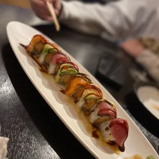 a long plate of sushi