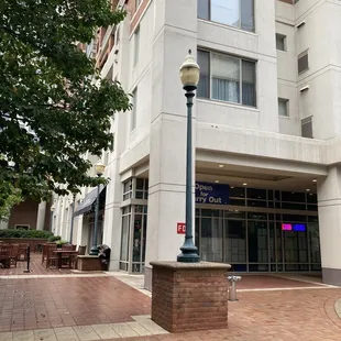 View of restaurant from outside, including outdoor seating to the left