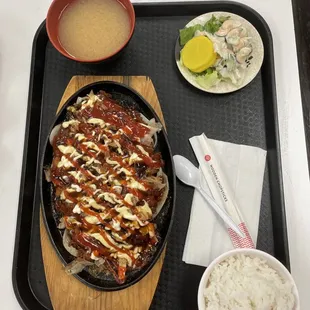 a plate of food and a bowl of rice