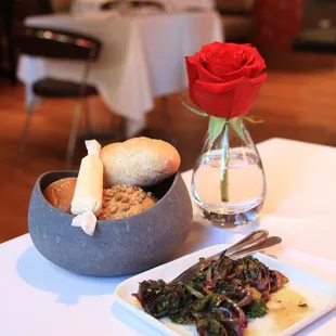 Complimentary artisan bread and sautéed baby kale.