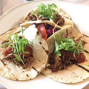 Pork tacos come w/ small red cabbage salad in the middle of the plate