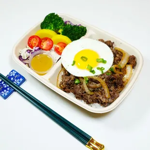 a bento box of food