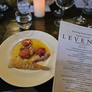 a menu and a plate of food