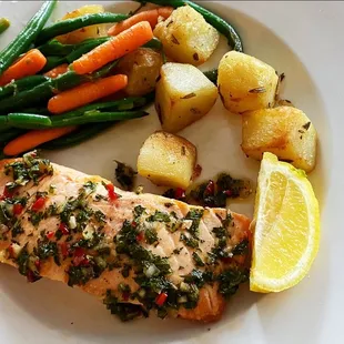 a plate of fish and vegetables