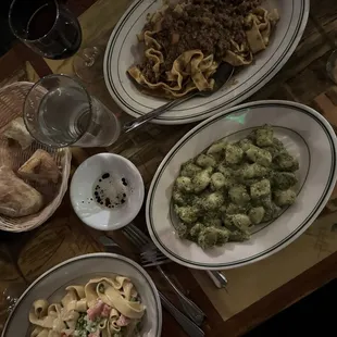 a variety of pasta dishes on a table