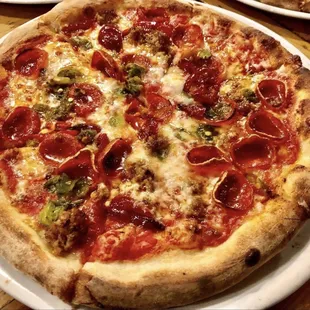 ZA ~ red sauce, pepperonis, Italian sausage, Hatch green chile, Calabrian chile, red peppadew peppers, fresh mozz, honey drizzle