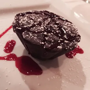 Chocolate ganache w raspberry sauce. Save room and pair with a cappuccino!