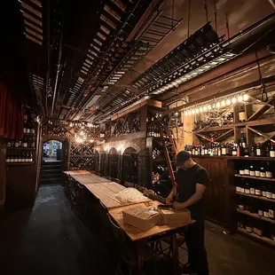 a man working in a wine cellar