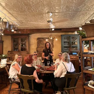 a group of people sitting around a table