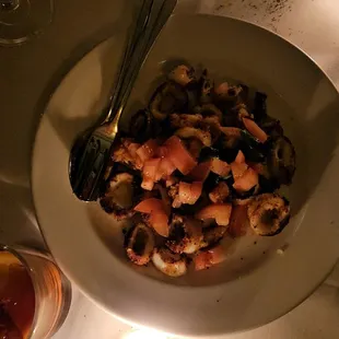 a plate of food and a glass of wine