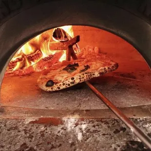 Our pizza is cooked in a Stefano Ferrara oven built by hand in true Neapolitan tradition.