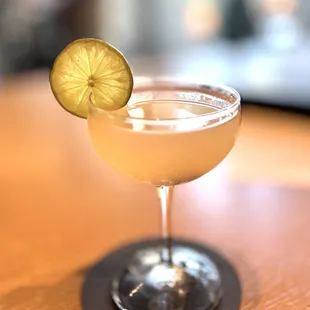 a margarita with a slice of lime on the rim