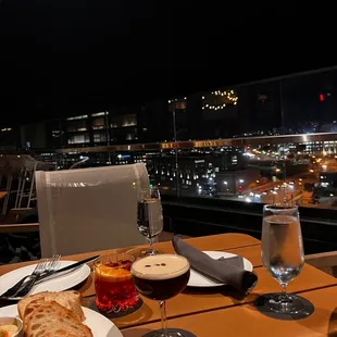 a table with a view of a city at night
