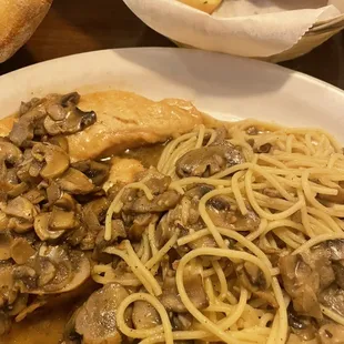 a plate of pasta and mushrooms