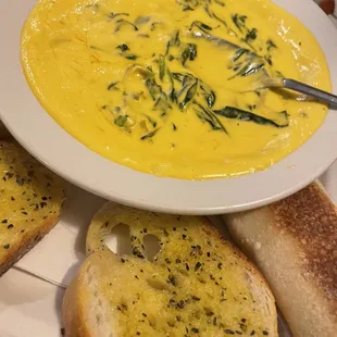 a bowl of soup and bread
