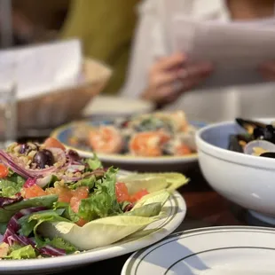 a plate of food and a bowl of salad