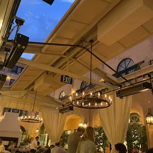 people sitting at tables in a restaurant