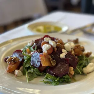 a beet salad with goat cheese and walnuts