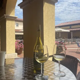 a bottle of wine and two glasses of wine