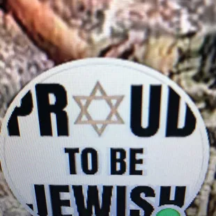 a sticker with the words proud to be jewish