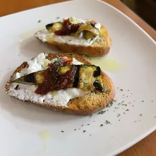Crostini with buffalo mozzarella, grilled zucchini, and a tomato jam.
