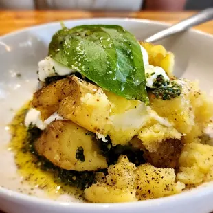 a bowl of food with a spoon in it