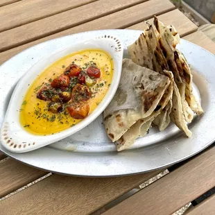 Calabrese hummus with fire-roasted tomatoes and flatbread