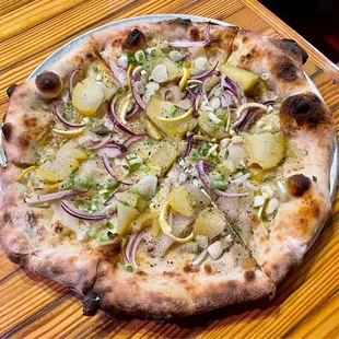 &quot;Things Found Underground&quot; pizza with onions, leeks, garlic, potatoes, fontina, and preserved lemon