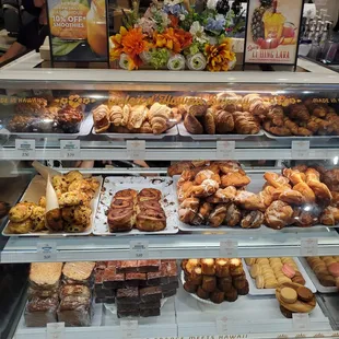 Pastries. Croissants, monkey bread, scones, macaroons, fritters, cinnamon roll, brownie, Canelé.