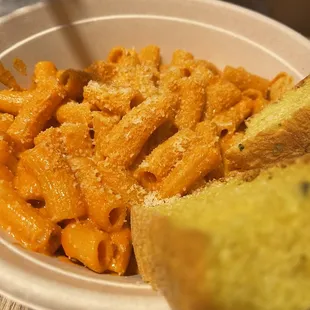 a plate of pasta and bread