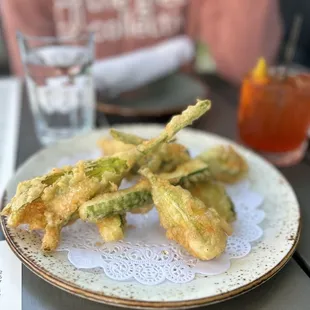 a plate of fried zucchini flowers